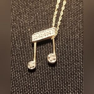 10k gold music note diamond pendant